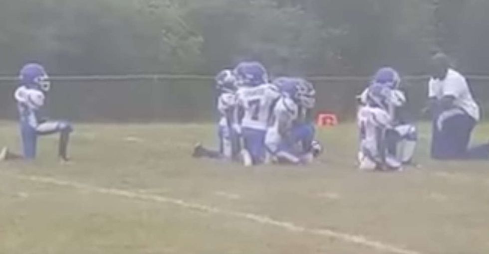 After a shocking verdict in St. Louis, these 8-year-olds protested on the football field.