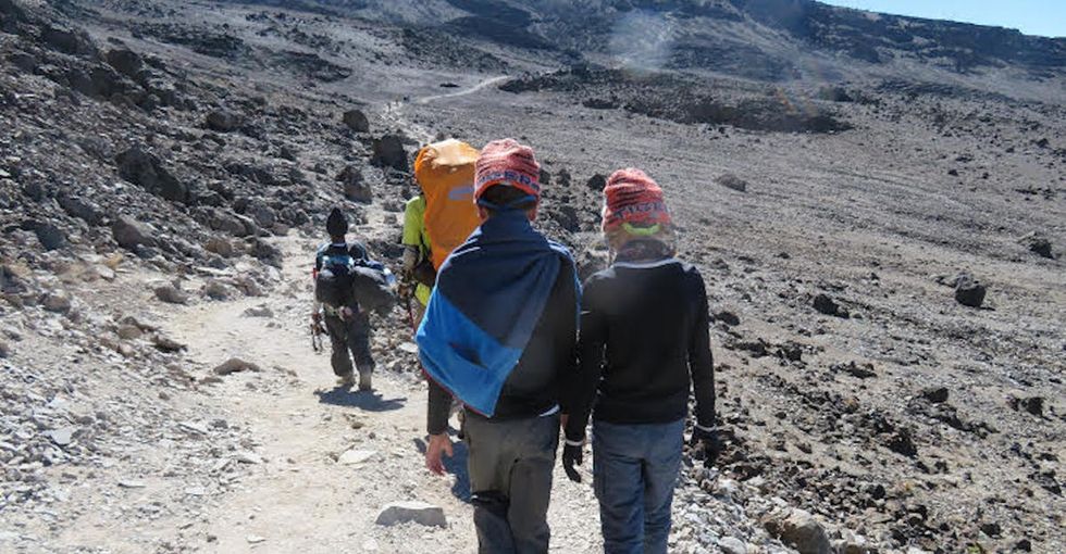 This family beat medical odds to climb the highest mountain in Africa. They set a record.