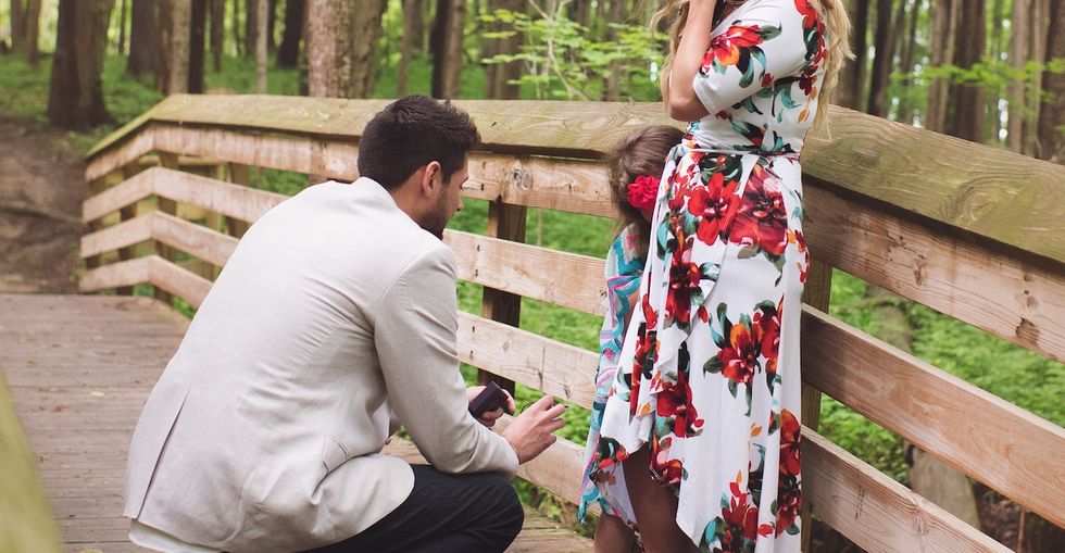 See the heart-bursting moment a man 'proposed' to his girlfriend's 5-year-old daughter.