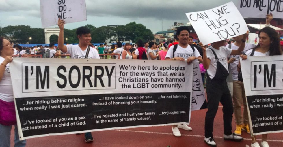 They went to Pride with 'I'm sorry' signs, and people are feeling all the feels.