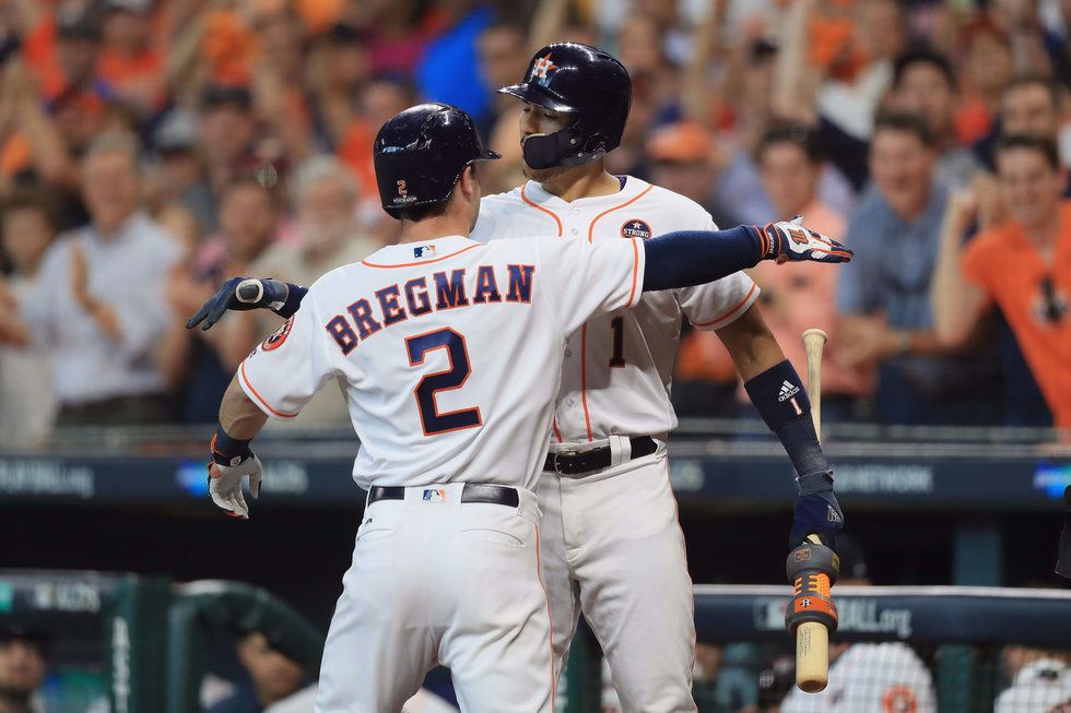 Alex Bregman and Carlos Correa celebrating in game one of the ALDS