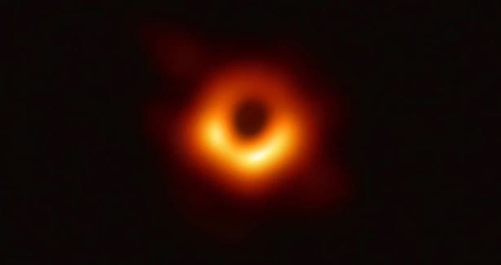 A photo of this researcher's unbridled joy after creating the first black hole image is going viral.