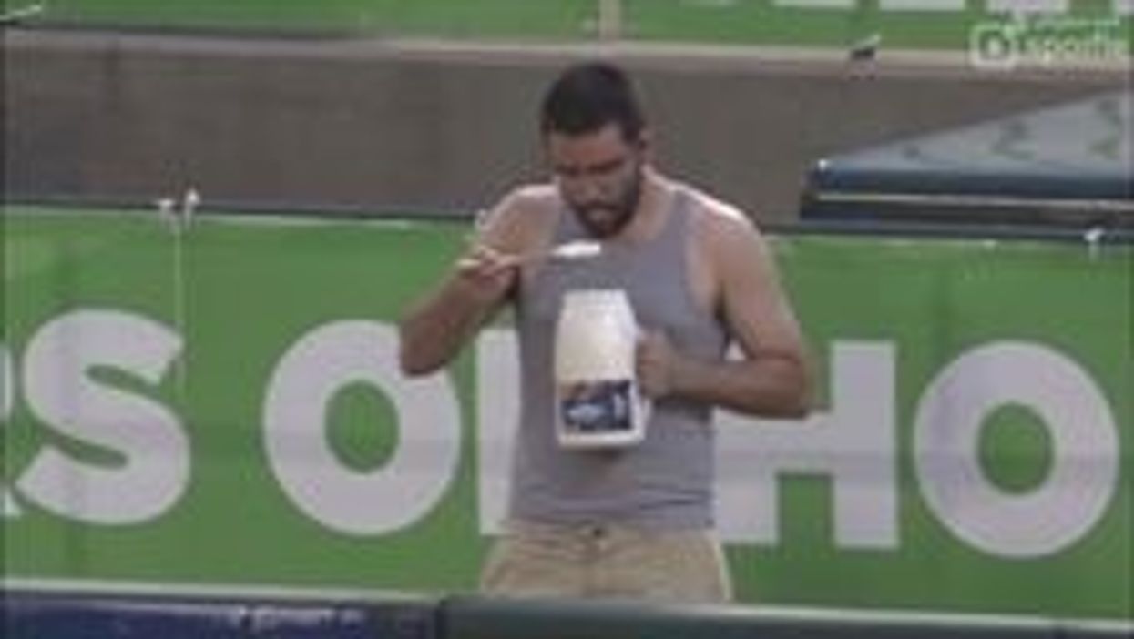 Man snacks on jug of mayo while watching Memphis Redbirds game