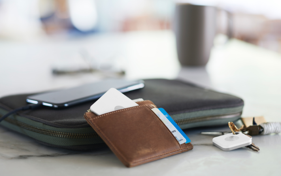 Photo of Tile Bluetooth tracks in a wallet and on a keychain
