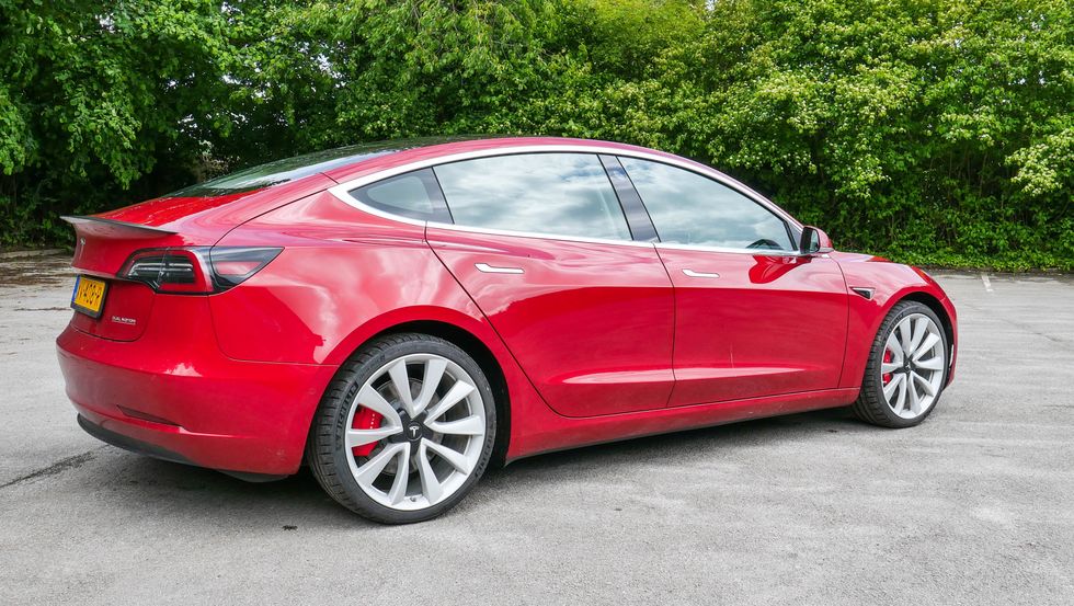 Photo of a red Tesla Model 3 Performance