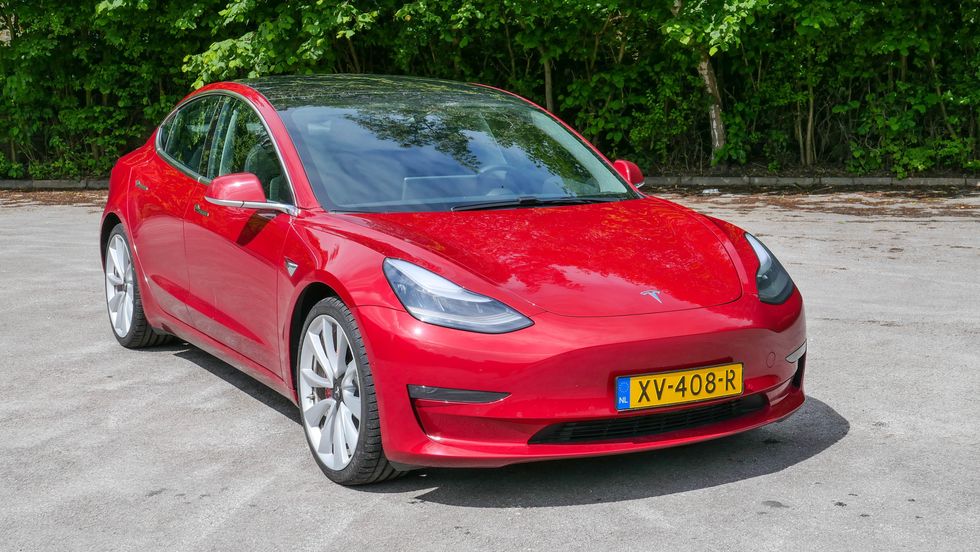 Photo of a red Tesla Model 3 Performance