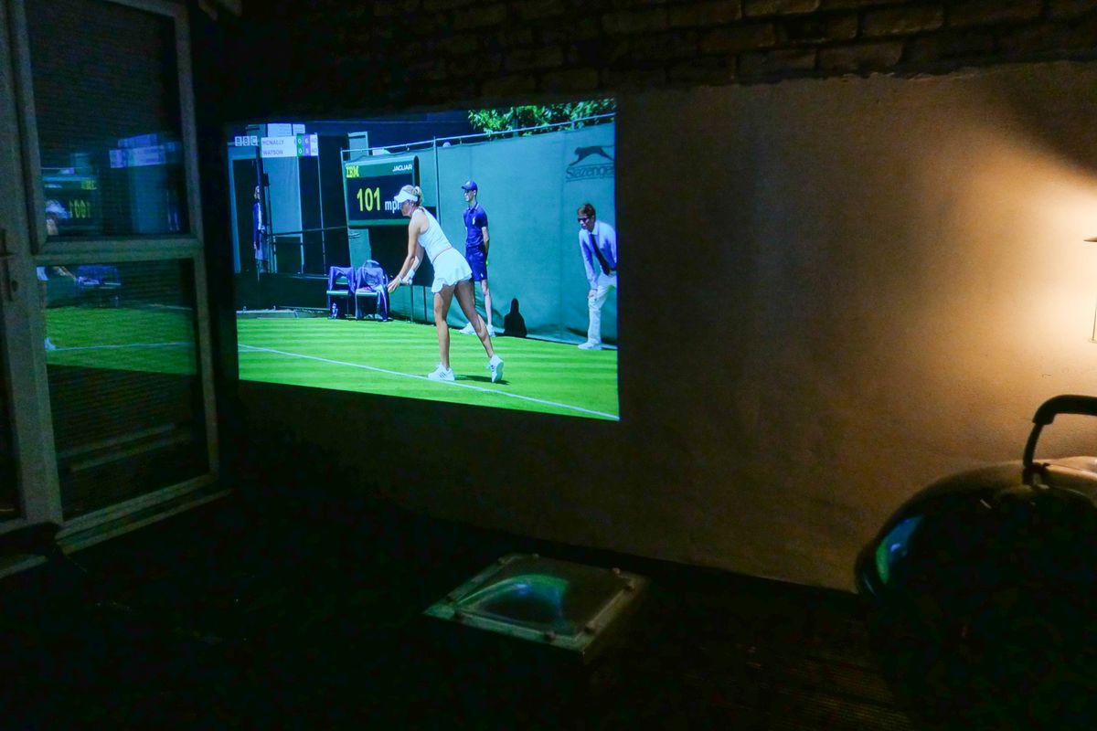 Photo of a projector working on an outside roof terrace