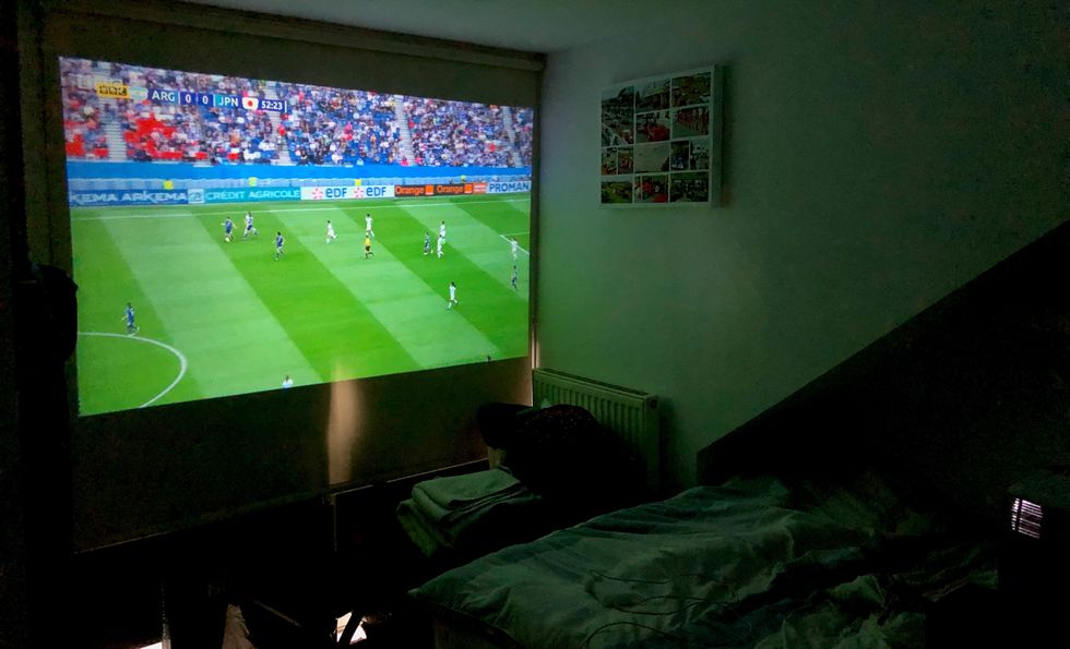 Photo of football shown on a projector