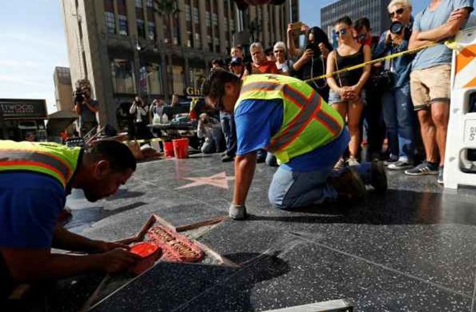 Hispanic Men Insulted By Trump Repaired His Vandalized Star On the Walk Of Fame