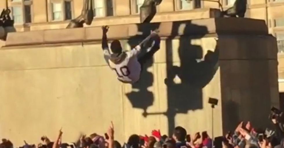 Cubs Fans Are Celebrating By Taking Insane Trust Falls Off Very Tall Objects