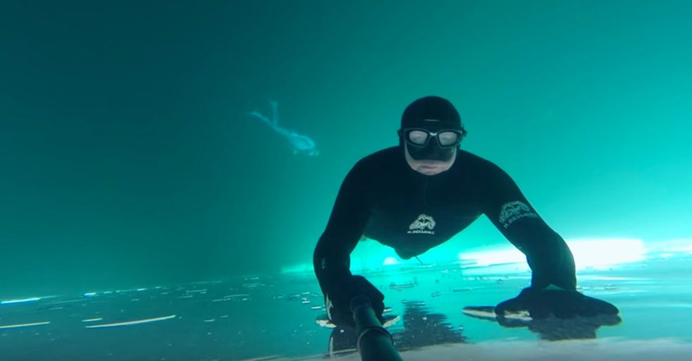 A Free Diver Makes A Beautifully Haunting Video While Swimming Under A Frozen Lake