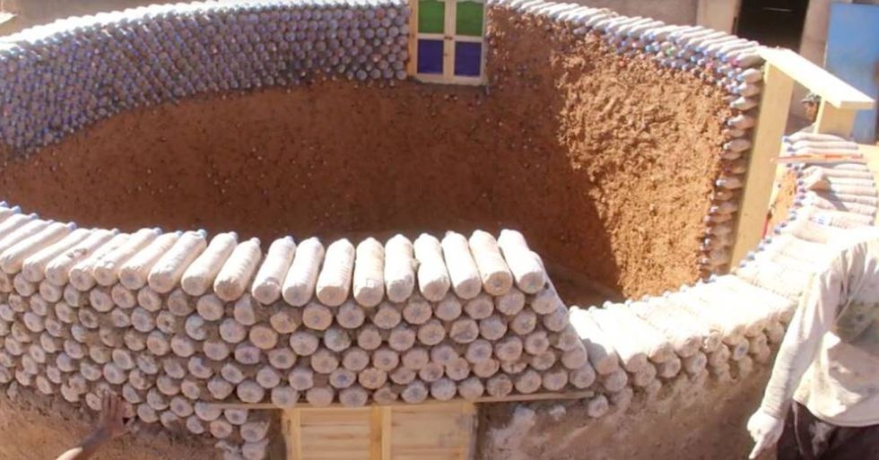 Refugee Transforms His Village By Creating Homes Out Of Discarded Plastic Bottles