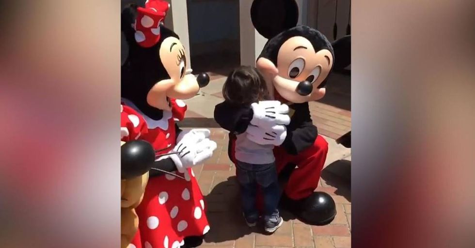 Touching Video Shows Disney Characters Signing With A Young Boy