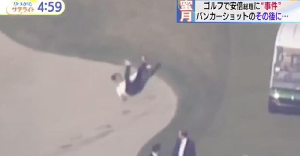 The Japanese Prime Minister Took A Fall Into A Sand Trap While An Impatient Trump Marched Down The Golf Course