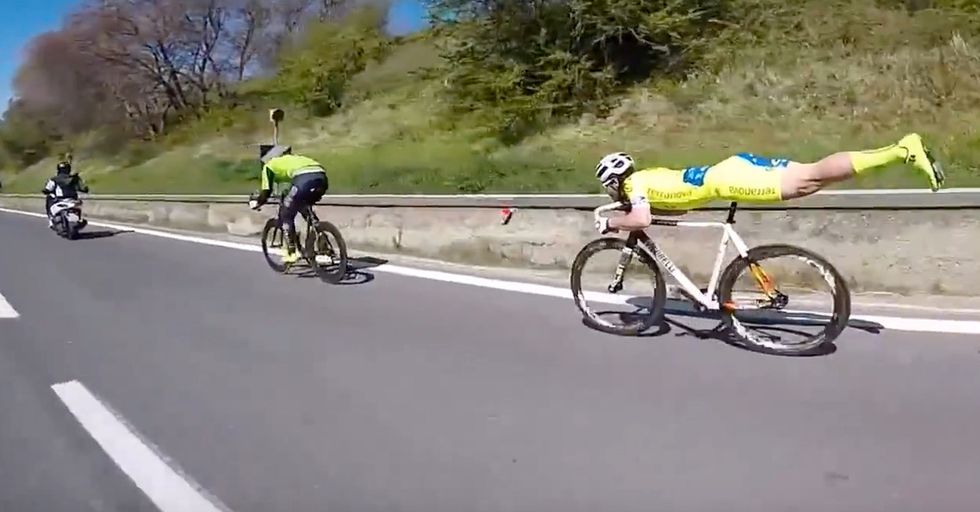 Random Act Of Sports: Cyclist Uses An Impressive Acrobatic Pose To Cruise By His Competition