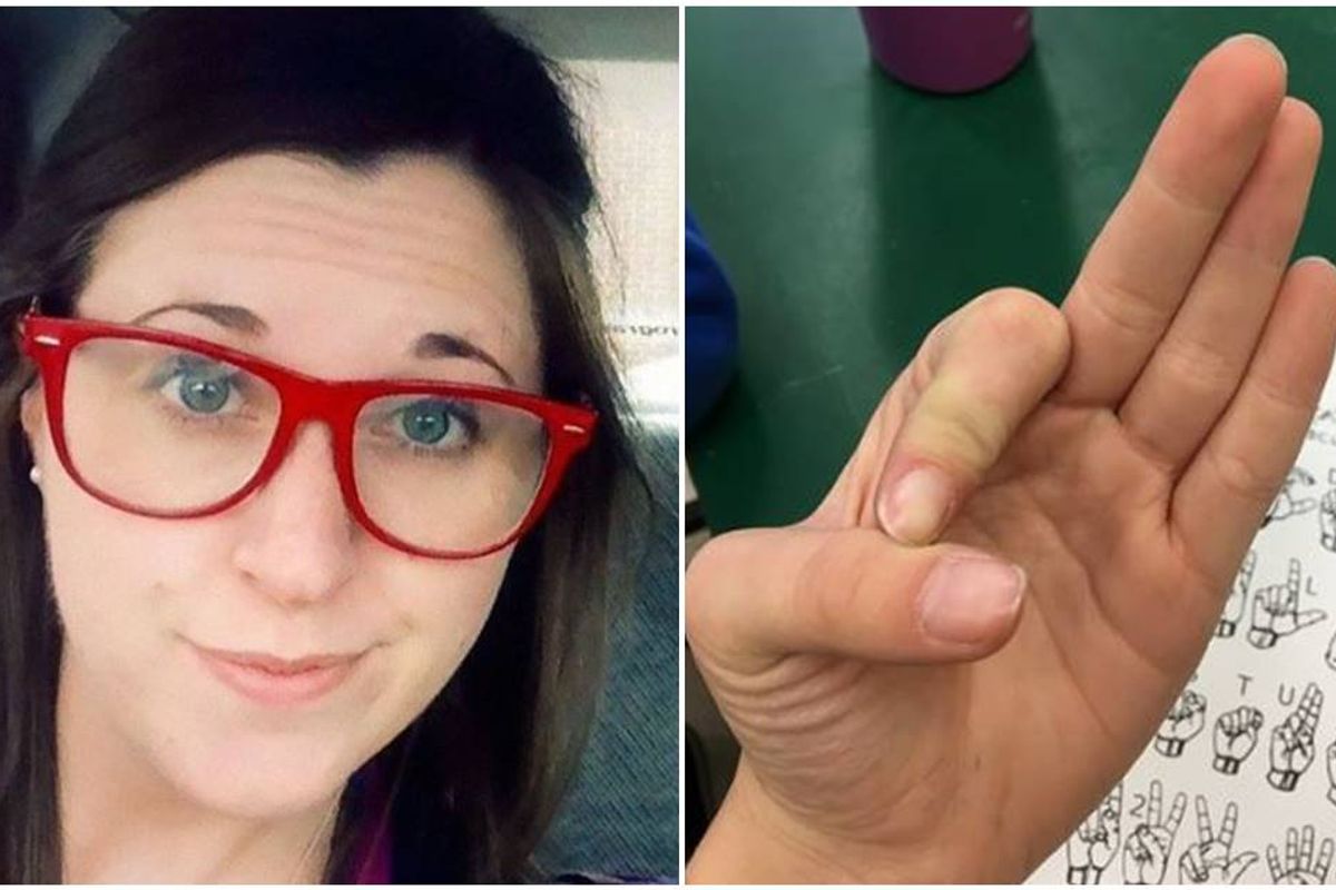 Woman's face; hand doing ASL