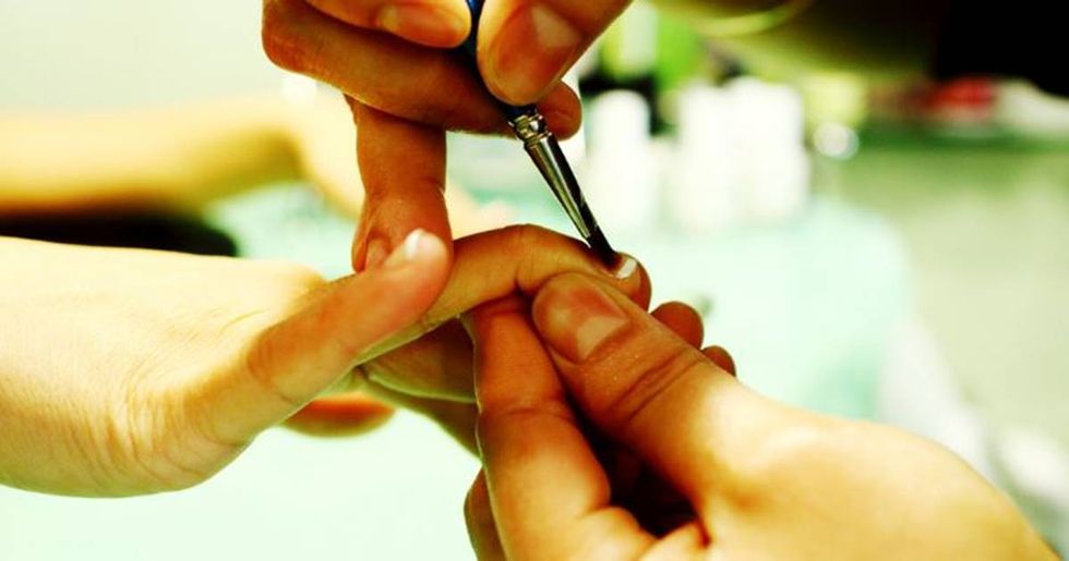 A nursing home manicurist’s photo is going viral for showing the beauty of aging.