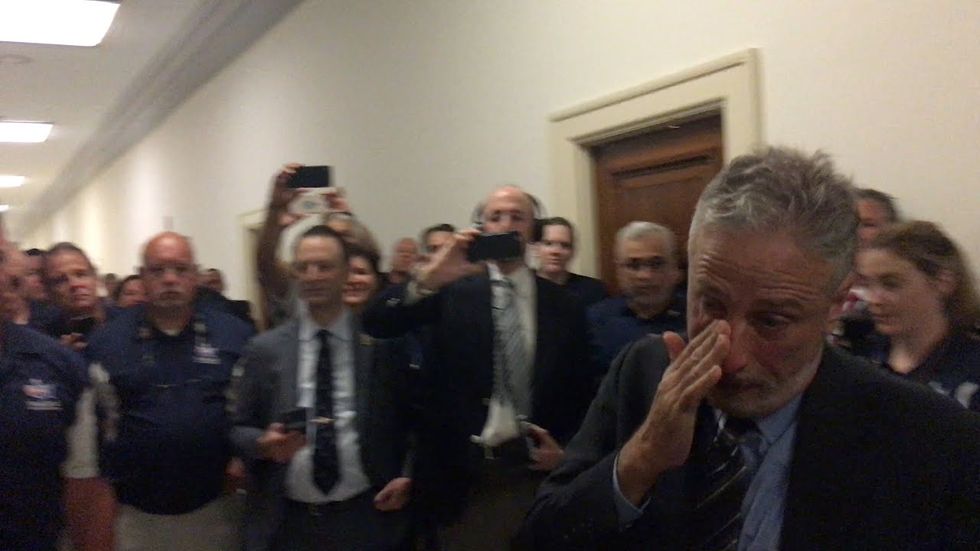 Jon Stewart unable to hold back tears when receiving 9/11 heroes’ gift.