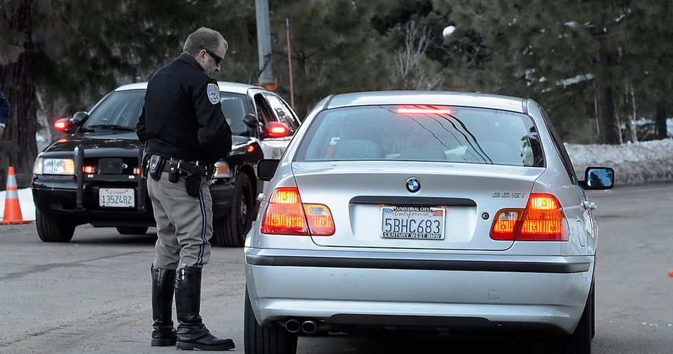 Why do police tap your tail light when you're pulled over?