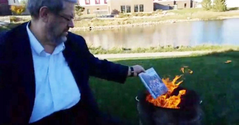 A homophobic man burned LGBT books at a gay pride festival and it backfired perfectly.