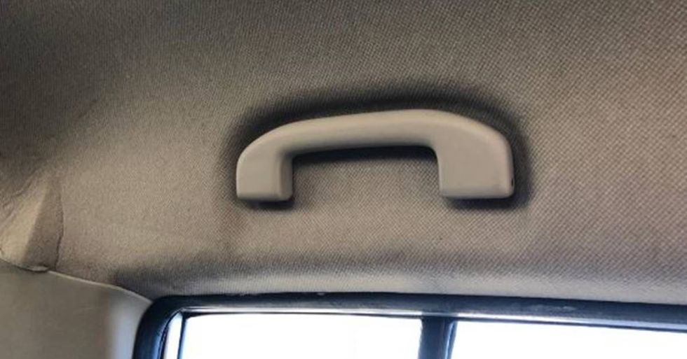 Someone figured out what that handle on car ceilings is for and Twitter is freaking out.