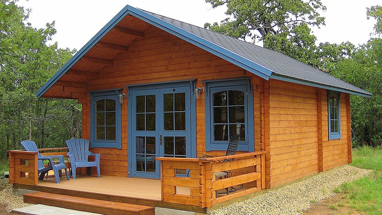 This DIY log cabin tiny house costs less than $20,000 and can be assembled in 2 days