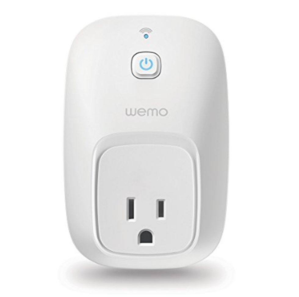 A Wemo switch and smart plug in white with a Bluetooth symbol on its top