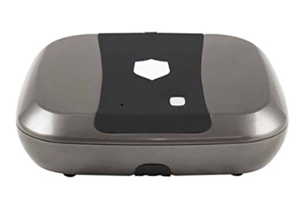 An image of briefcase sized safe in gray metal with a shield image on its top