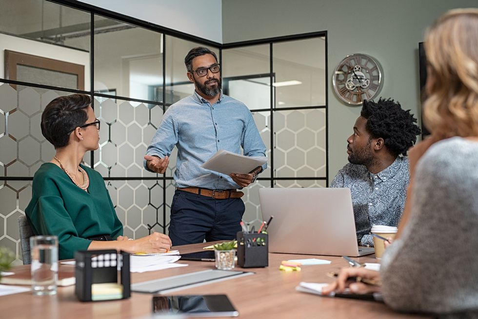 A good leader speaks with confidence during a meeting