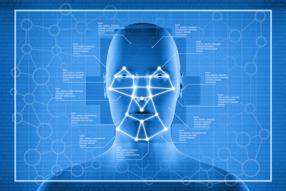 The image of a robotic face with lines drawn across and data points against a blue background