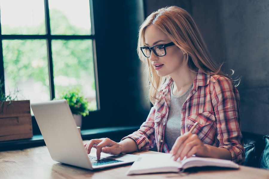 Woman writing cover letter for job application
