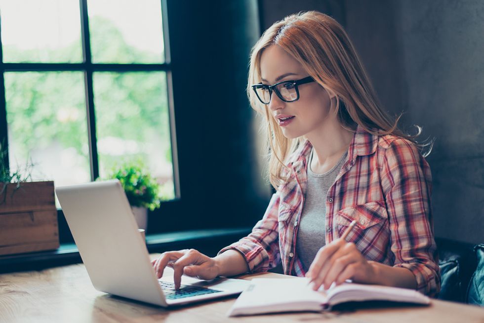 Woman writing cover letter for job application