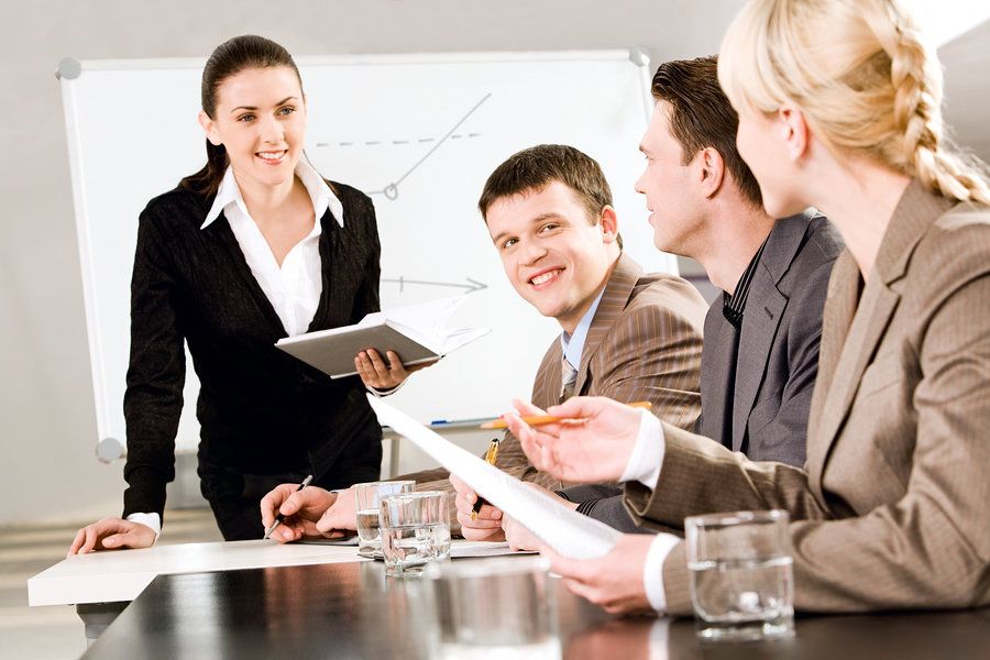 Young professional networks with a group of her peers