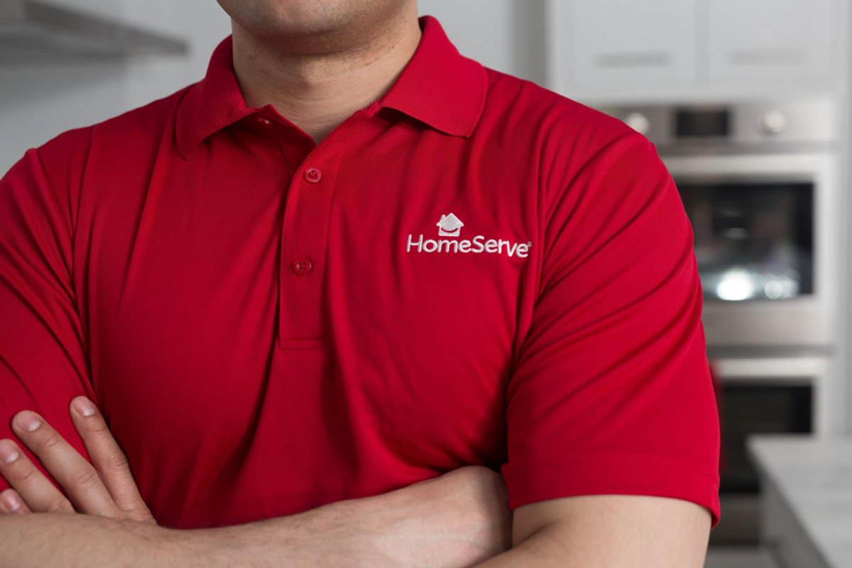 mildly buff man in a red homeserve polo