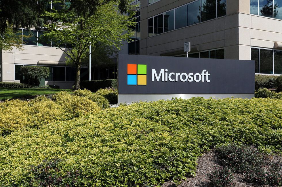 A Microsoft office sign in a business park, with greenery around