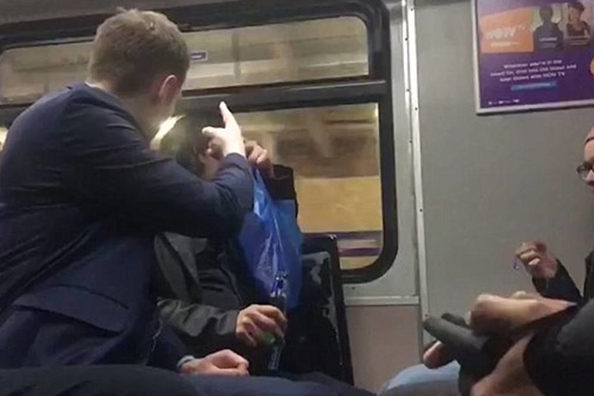 A drunk man was filmed harassing an immigrant on a train. The woman next to him responded in the most British way.
