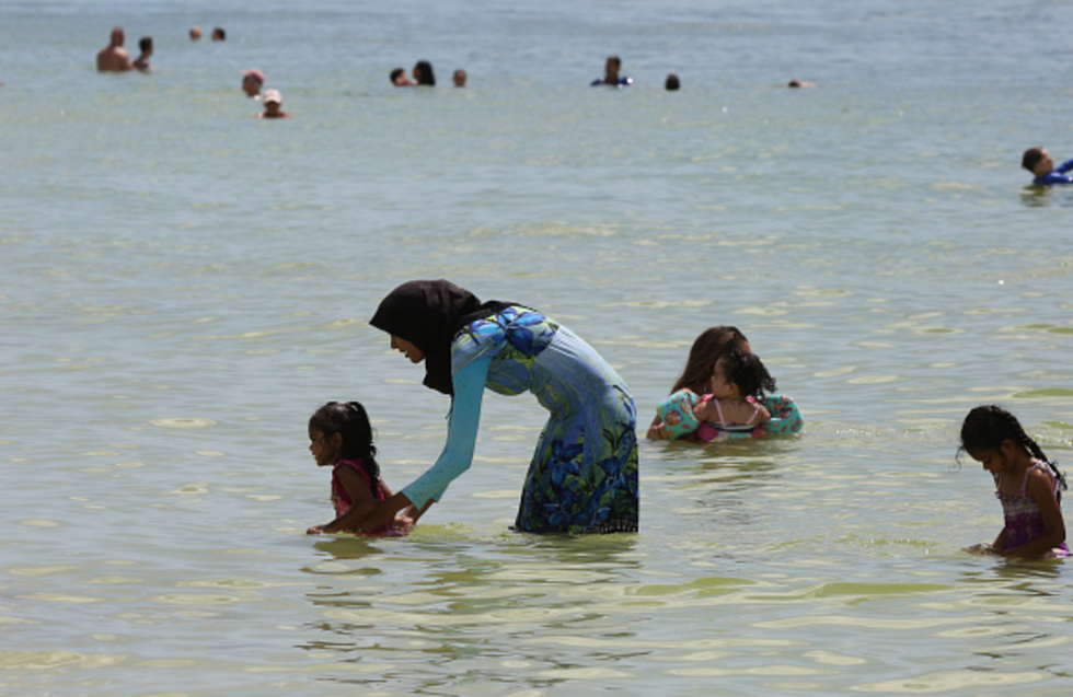 Muslim women protest burkini ban in France swimming pool