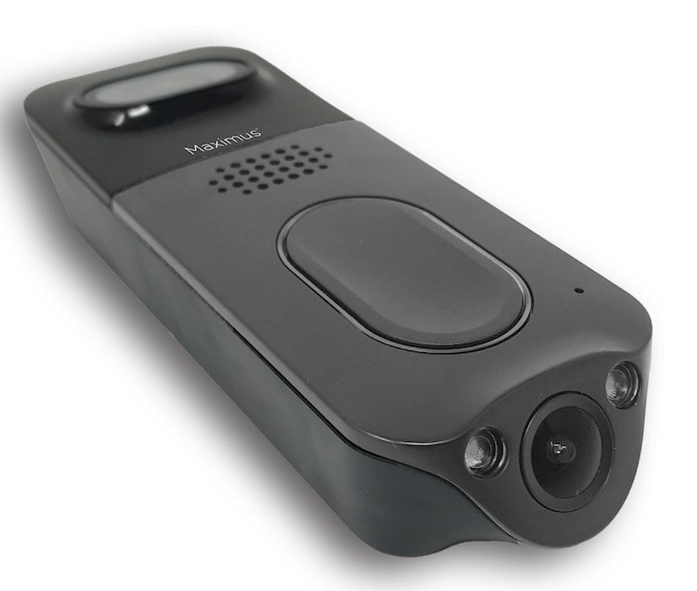 A dark gray video doorbell with a camera at one end on the bottom and a large button on its face