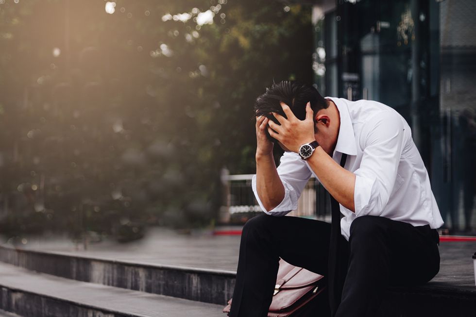 Young businessman is laid off because of a recession