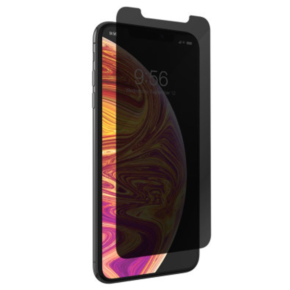 An iPhone with a darkened screen protector half on top