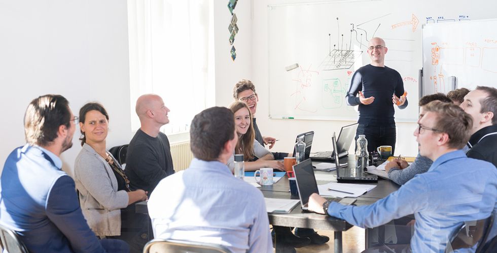 Man using his leadership skills during group presentation.