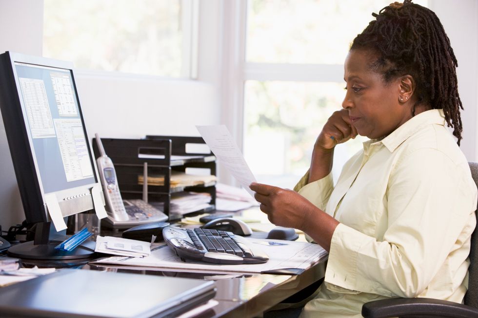 Hiring manager looking over resume explaining job gap