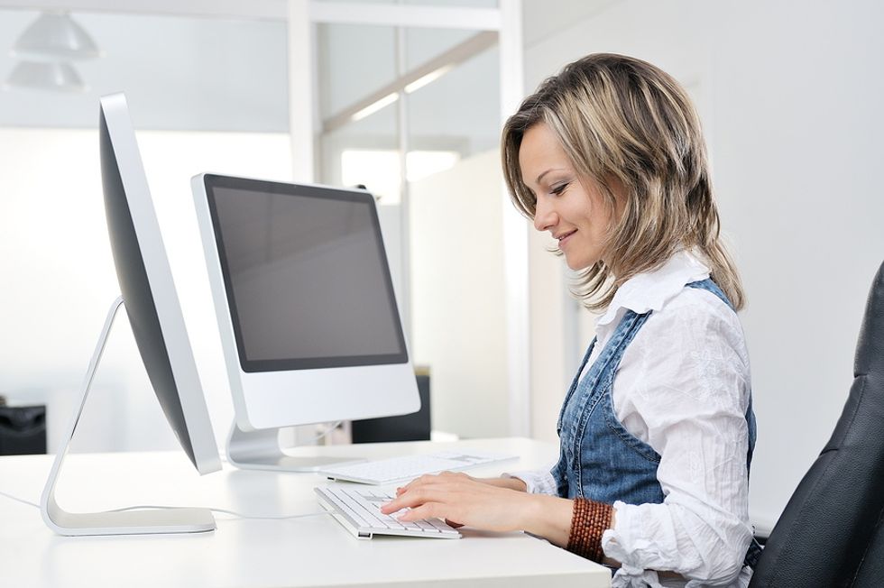 Young businesswoman working hard at her desk.