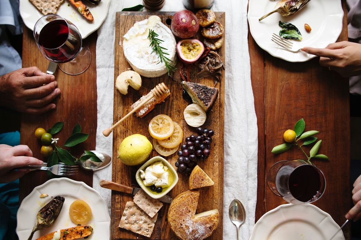 dinner party table with wine and cheese