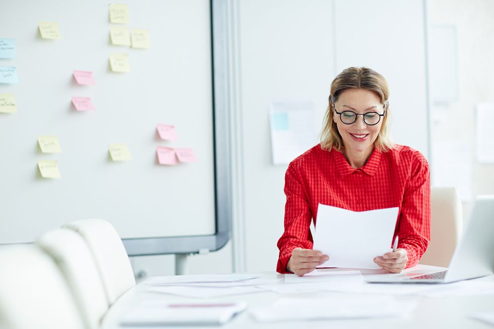 Employer reads an executive resume that aligns with their needs