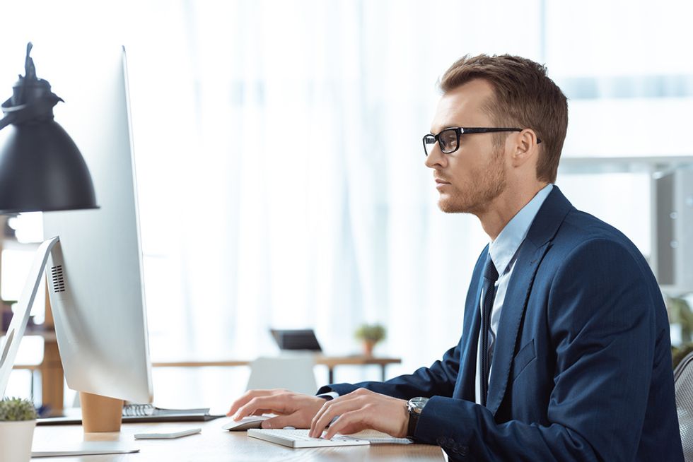 Man enrolling in a leadership course to sharpen his leadership skills and climb the ladder at work.