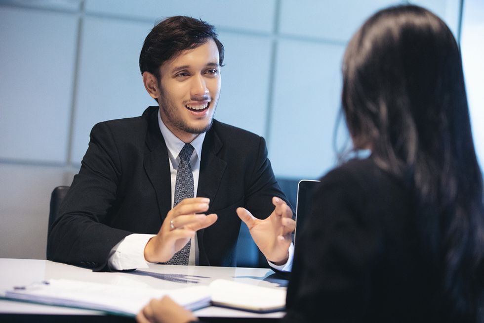 Professional man answers behavioral questions during a job interview