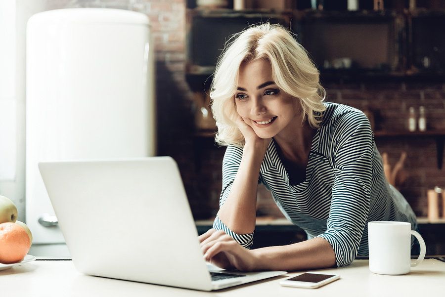 Young woman blogs about her industry in order to stay relevant during a career gap.