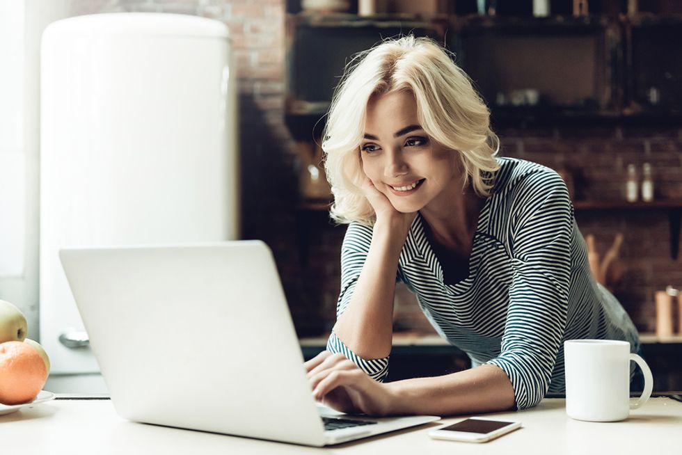Young woman blogs about her industry in order to stay relevant during a career gap.