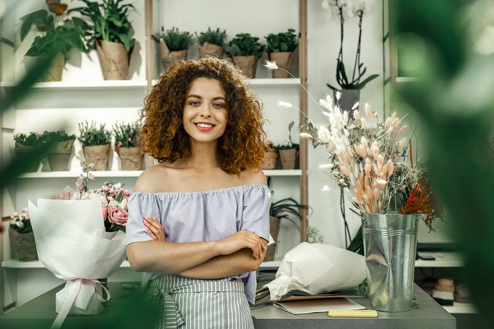 Young woman works a part-time job while seeking a full-time position.